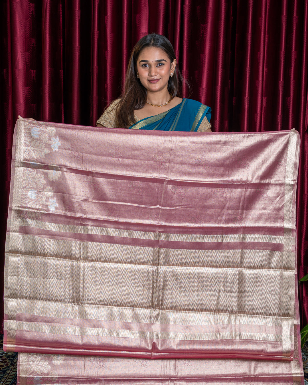 Broad gold zari chevron pallu with pink bands and floral design